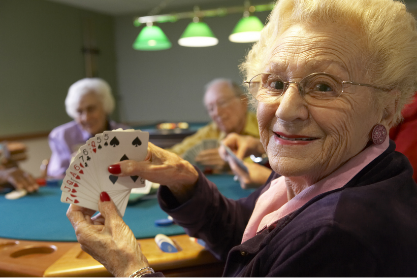 adults playing cards