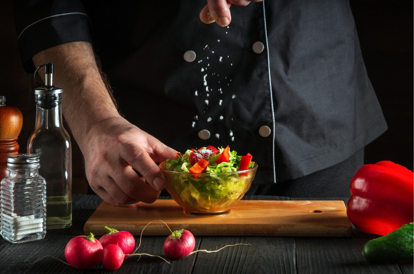 man making a fresh salad