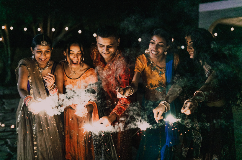 friends with sprinklers on diwali
